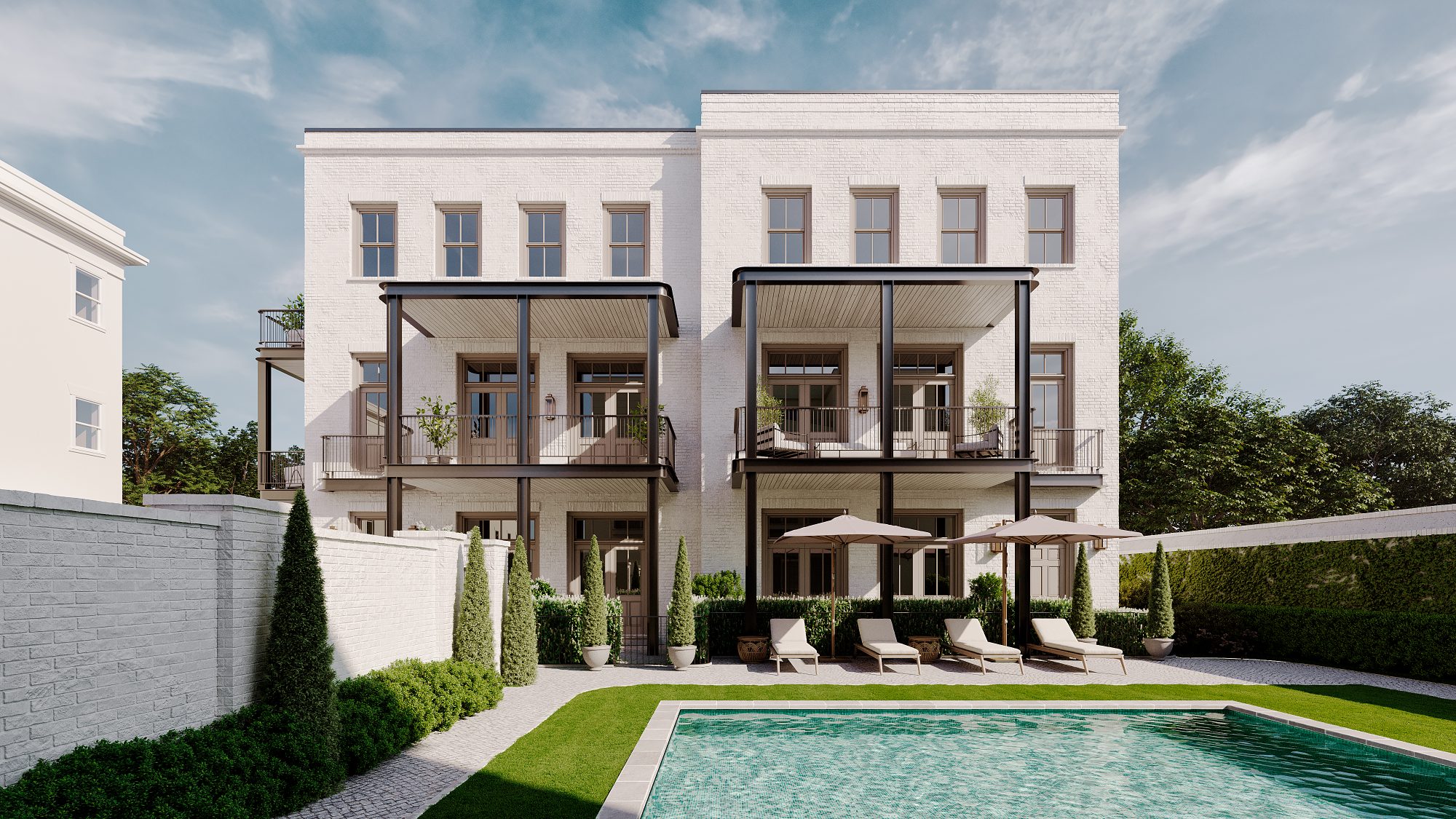 Rear elevation of the two townhomes with pool and garden courtyard
